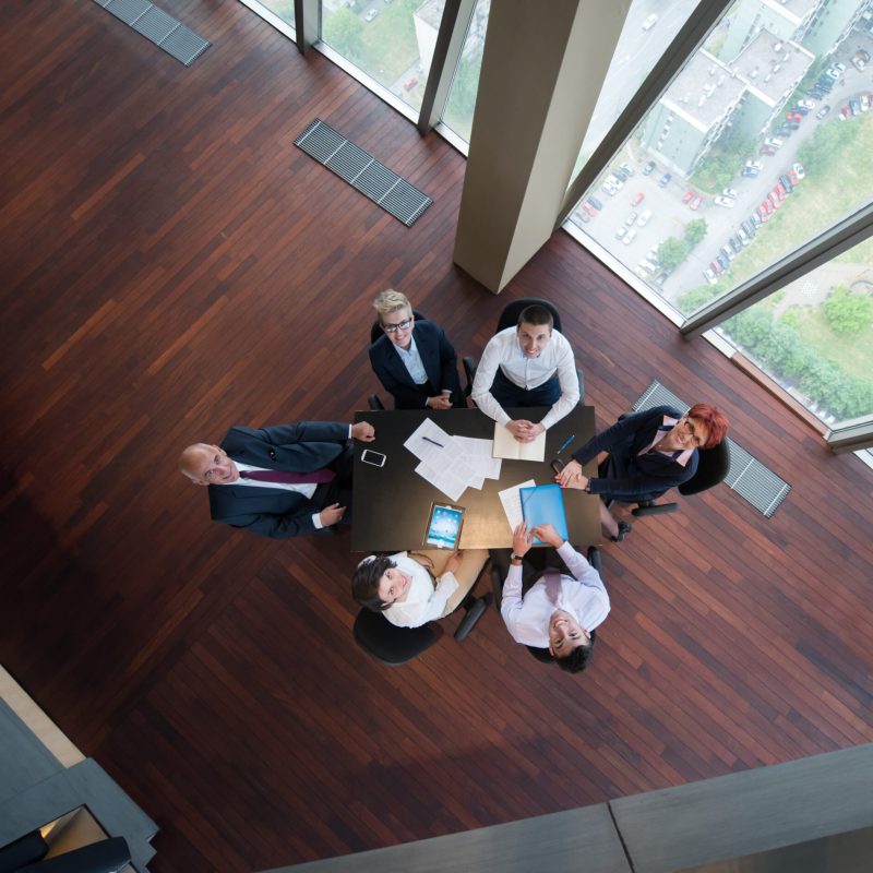 happy business people group on meeting at modern office